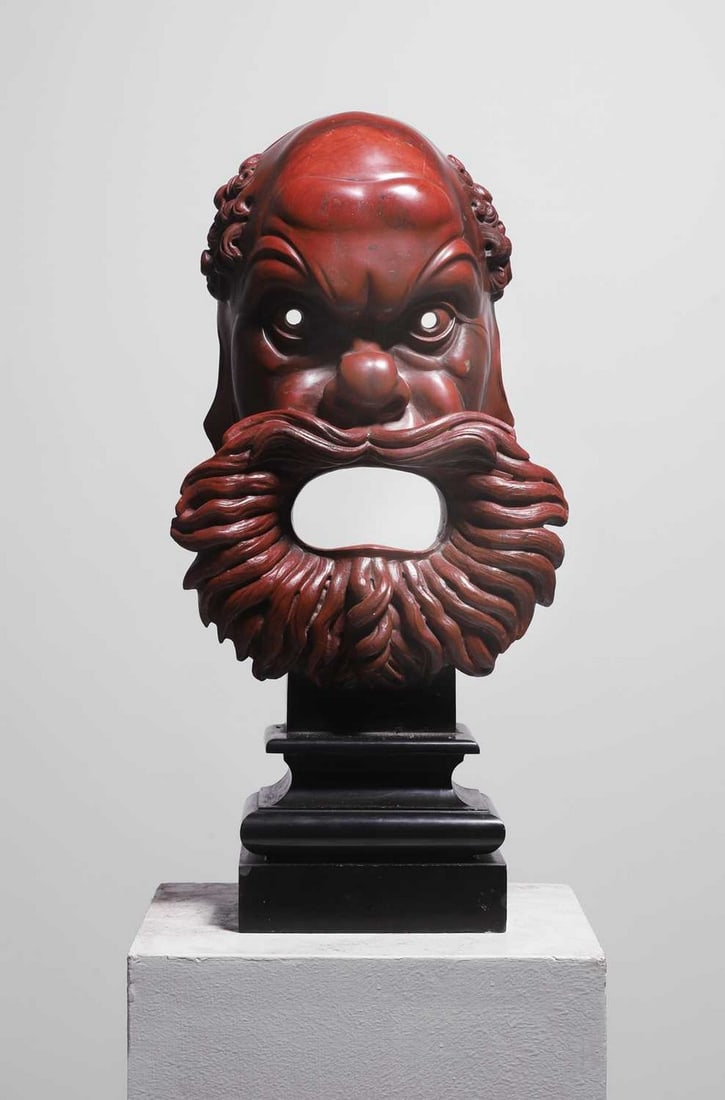 Manner of Benedetto Boschetti, A carved rosso antico marble mask, (1 of 6)
