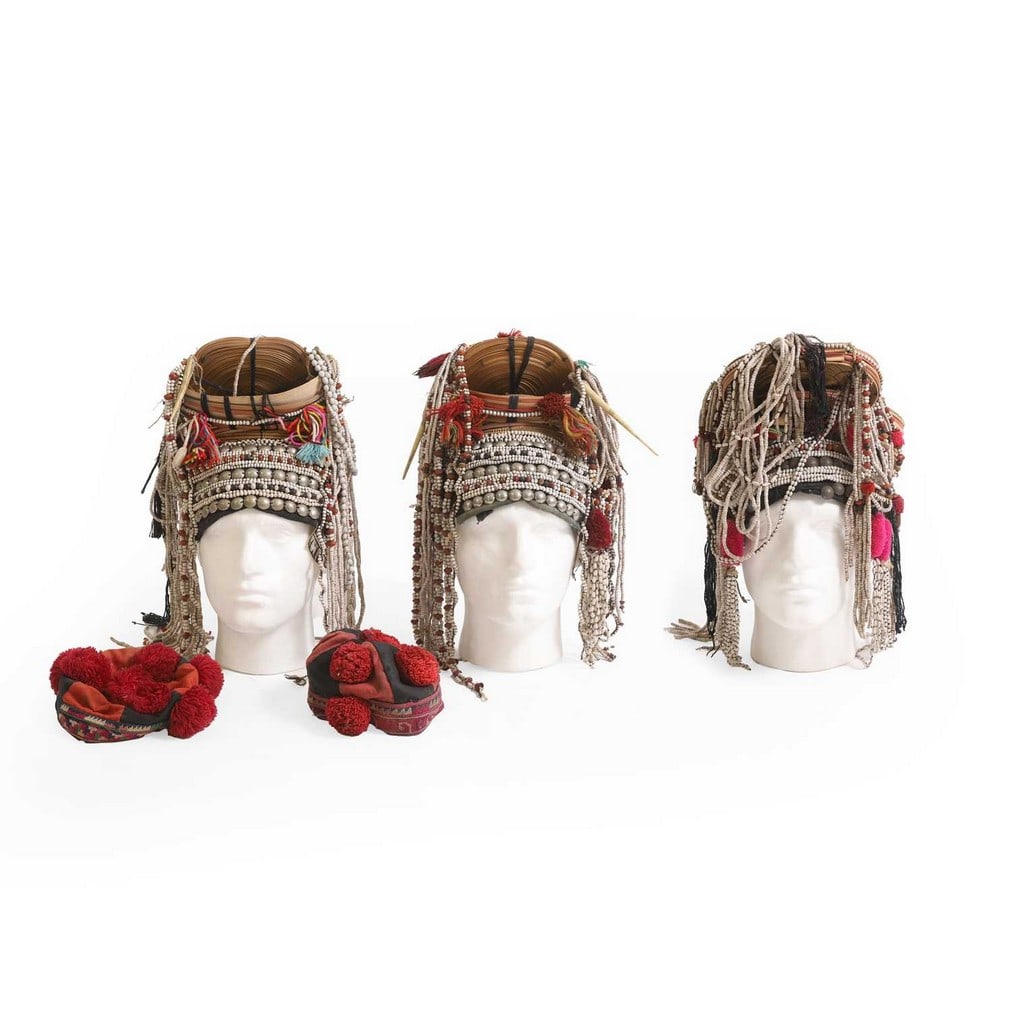 A group of five tribal hats and headdresses, 20th century, Thai, (1 of 5)