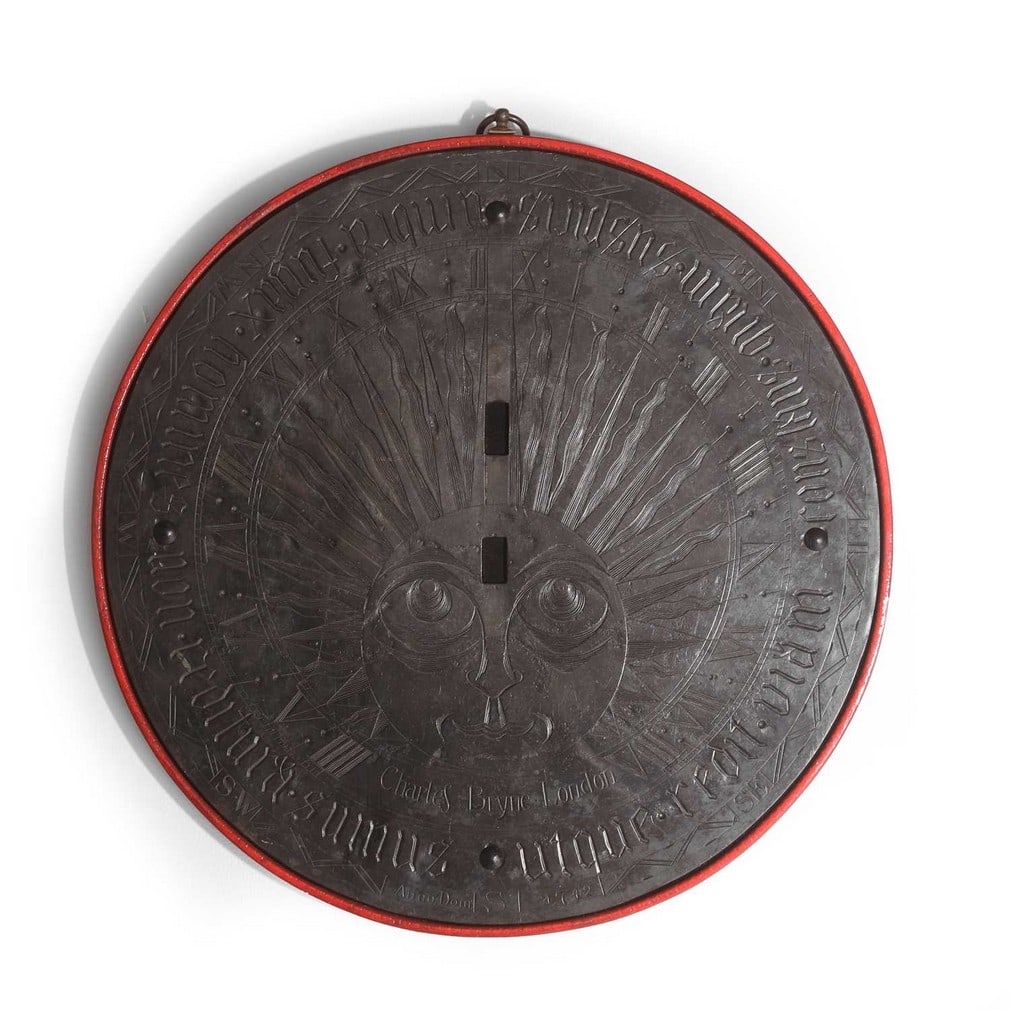 A bronze sundial plate signed Charles Bryne, London, mid-18th century,: A bronze sundial plate signed Charles Bryne, London, mid-18th century, engraved with an animalistic sun, Roman numerals and a Latin inscription reading 'utque redit viam constans quam suspiris umbra f