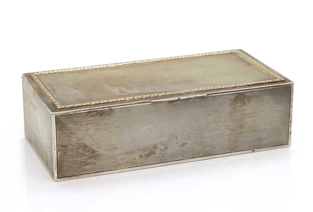 A silver cigarette box, (1 of 3)