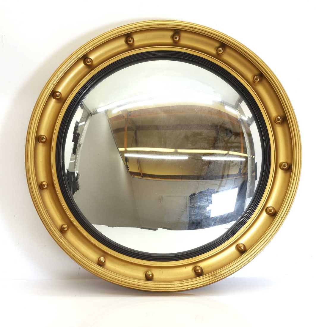 A gilded convex mirror 20th / 21st century (1 of 2)