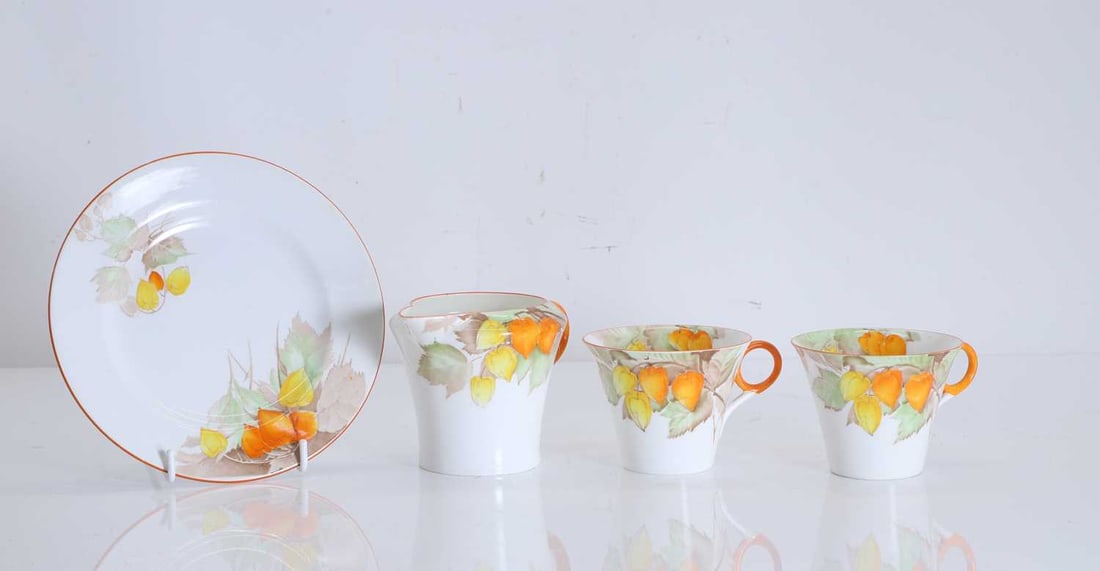 A collection of Shelley tea and dinnerwares Of modern manufacture: A collection of Shelley tea and dinnerwares Of modern manufacture Pattern no. W12299, comprising two large serving plates, a teapot, a coffee pot, a large lidded serving dish, a collection of tea cup