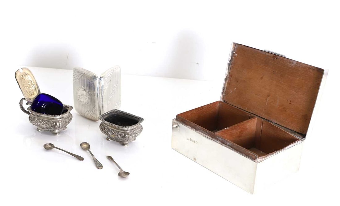 A silver cigarette box, Birmingham, 1944: A silver cigarette box, Birmingham, 1944 a silver cigarette case, Birmingham, 1902, a condiment set, 1896, and three matched spoons box, 17cm wide, cigarette case, 9cm, condimets largest 6.cm high,