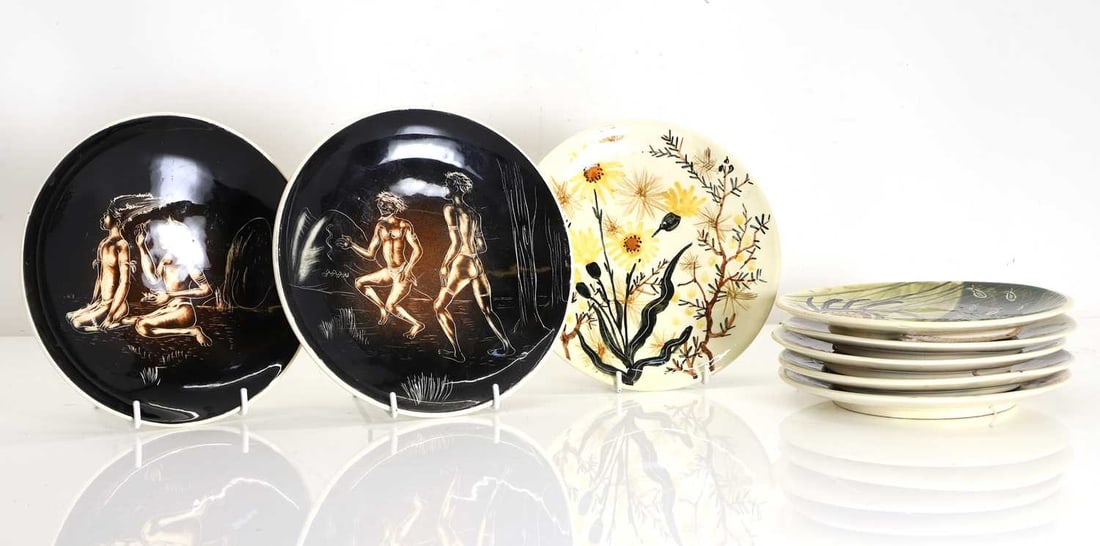 A collection of eight Australian wall plates, Of modern manufacture,: A collection of eight Australian wall plates, Of modern manufacture, Five by Martin Boyd, decorated with flora and fauna native to Australia, with incised marks to the base, together with two Galart
