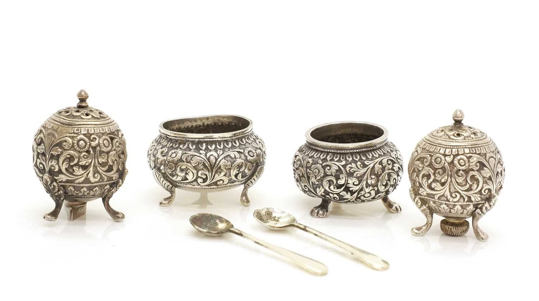 An Indian silver four piece condiment set, (1 of 2)