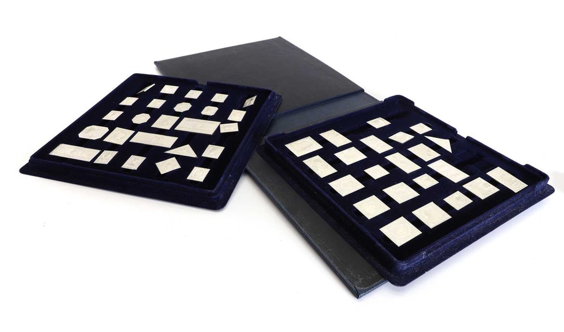 International Society of Postmasters, a sterling silver proof of the Greatest Stamps of the British: International Society of Postmasters, a sterling silver proof of the Greatest Stamps of the British Empire in two fitted trays, in a folding cover and with a box with certificates Largest, 6cm wide,