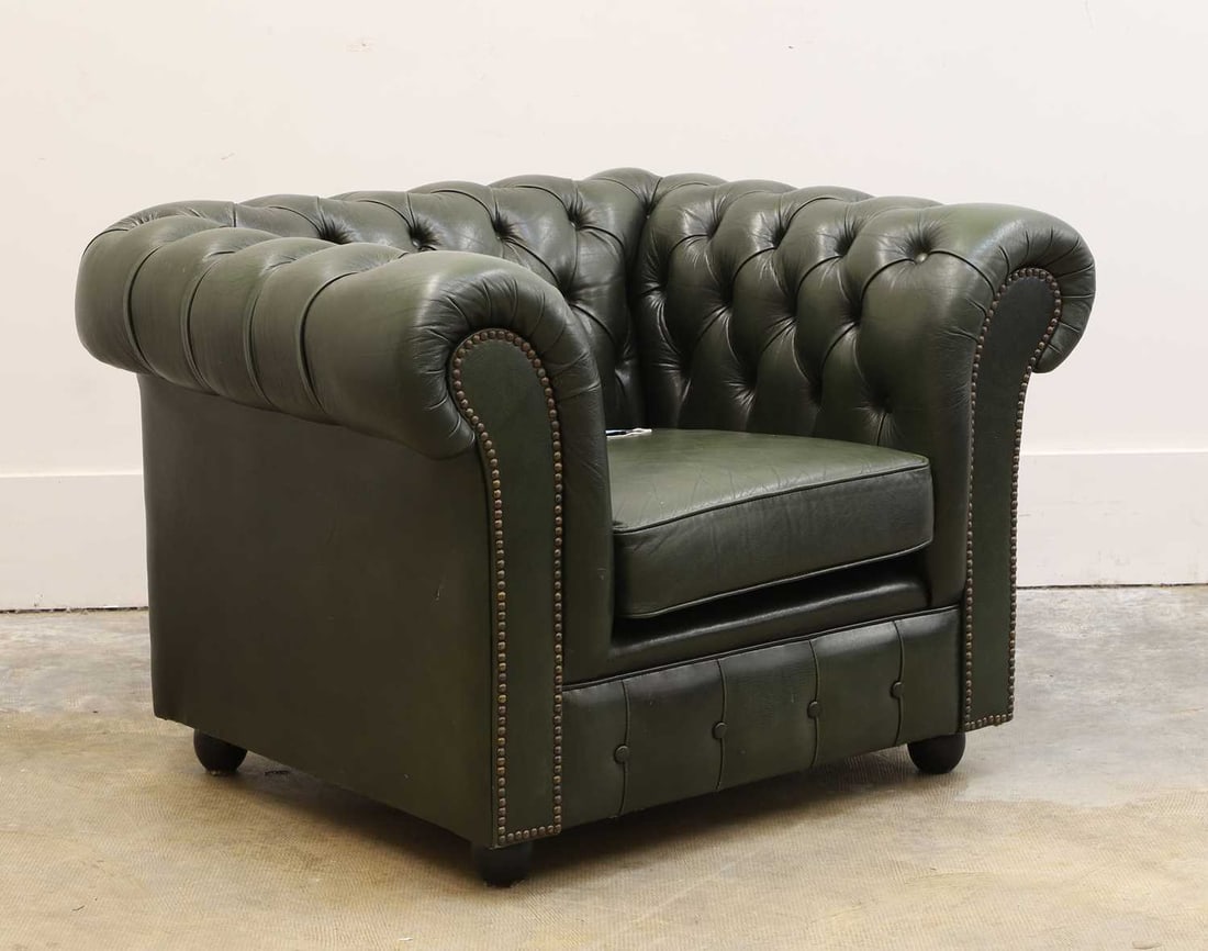 A green leather Chesterfield style armchair, 20th century, (1 of 2)
