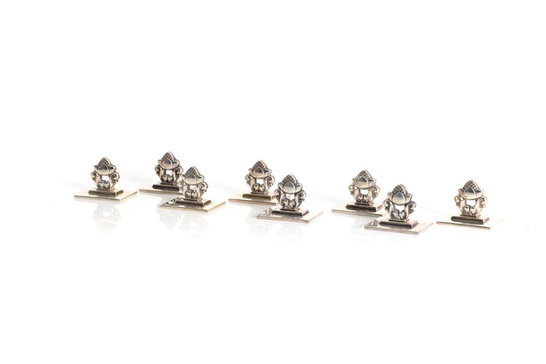 A set of eight Georg Jensen 'Acorn' pattern sterling silver 925 menu holders, Import hallmarked for: A set of eight Georg Jensen 'Acorn' pattern sterling silver 925 menu holders, Import hallmarked for 1990, Designed by Johan Rohde in 1915, stamped marks each 3cm wide, 2cm deep, 2cm high, 5.2ozt appr