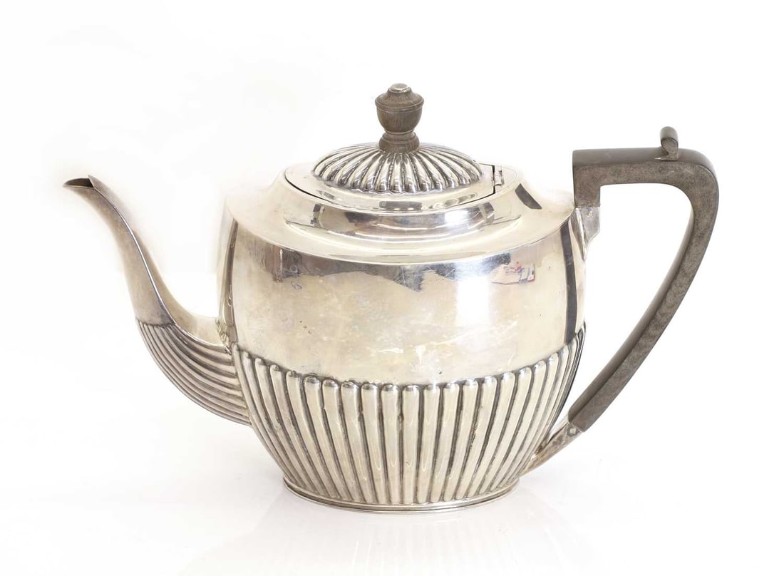 A silver teapot, (1 of 3)
