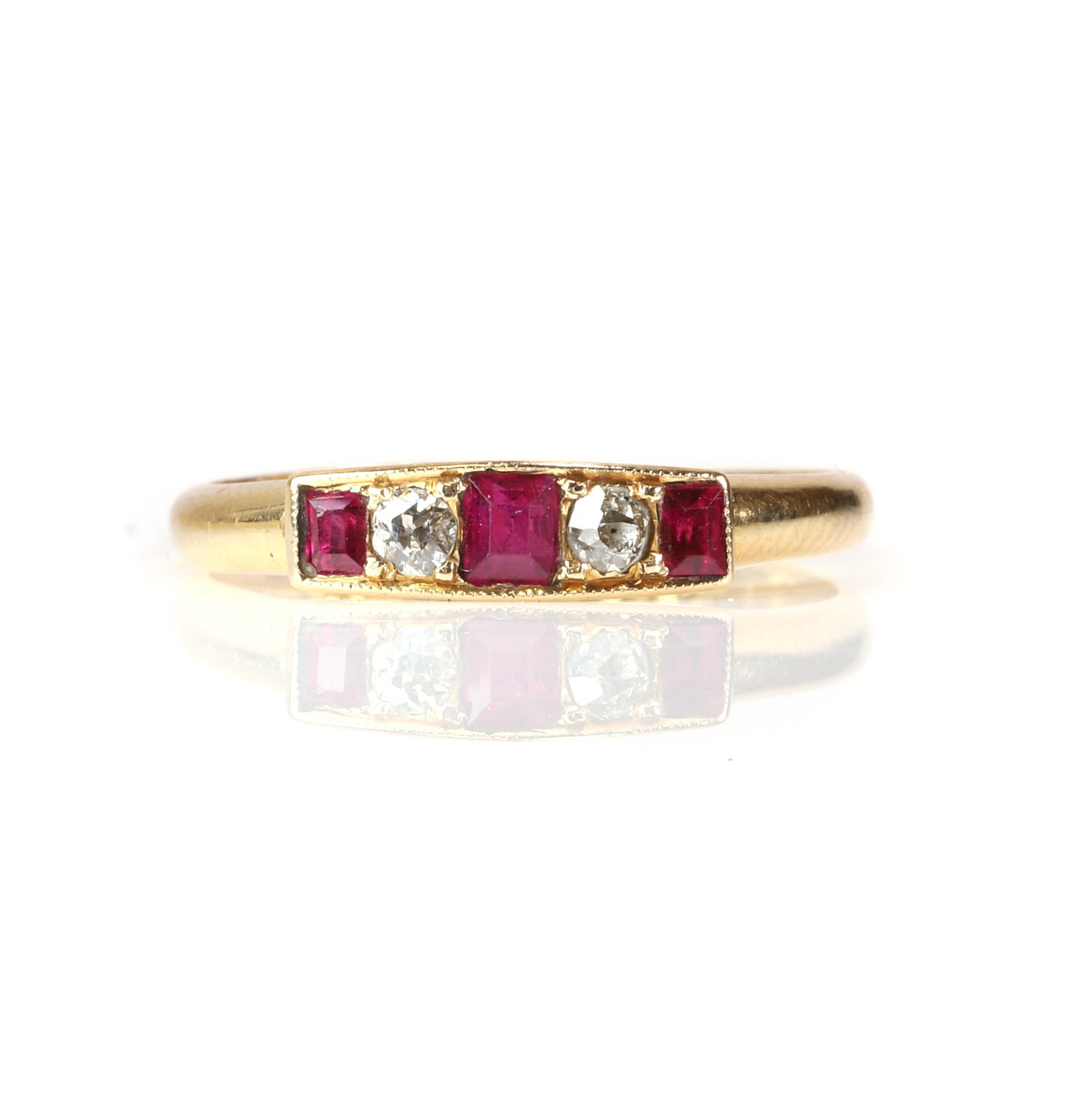 An Edwardian 18ct gold ruby and diamond five stone ring, (1 of 3)