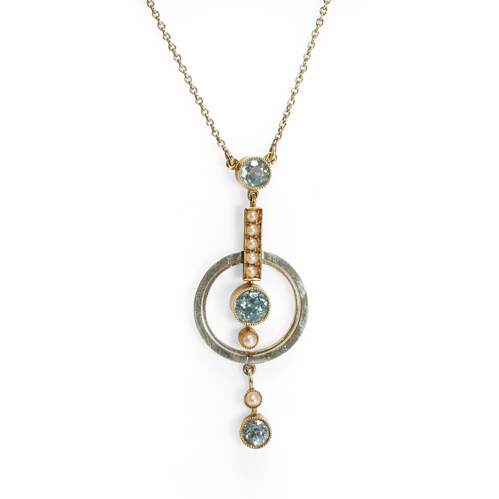 An Edwardian blue zircon and split pearl pendant necklace,: An Edwardian blue zircon and split pearl pendant necklace, the articulated pendant with a round cut blue zircon to the top, into a central round cut blue zircon with a double wire halo surround, to a