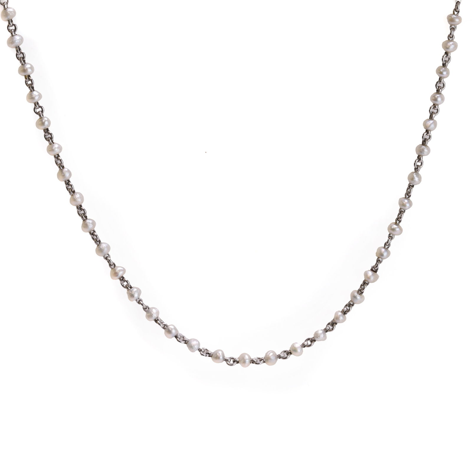 An Edwardian seed pearl chain,: An Edwardian seed pearl chain, the chain set with seed pearls of irregular shape and approximately 2 to 2.5mm in diameter, untested, threaded between chain links, leading to a bolt ring clasp. In unma