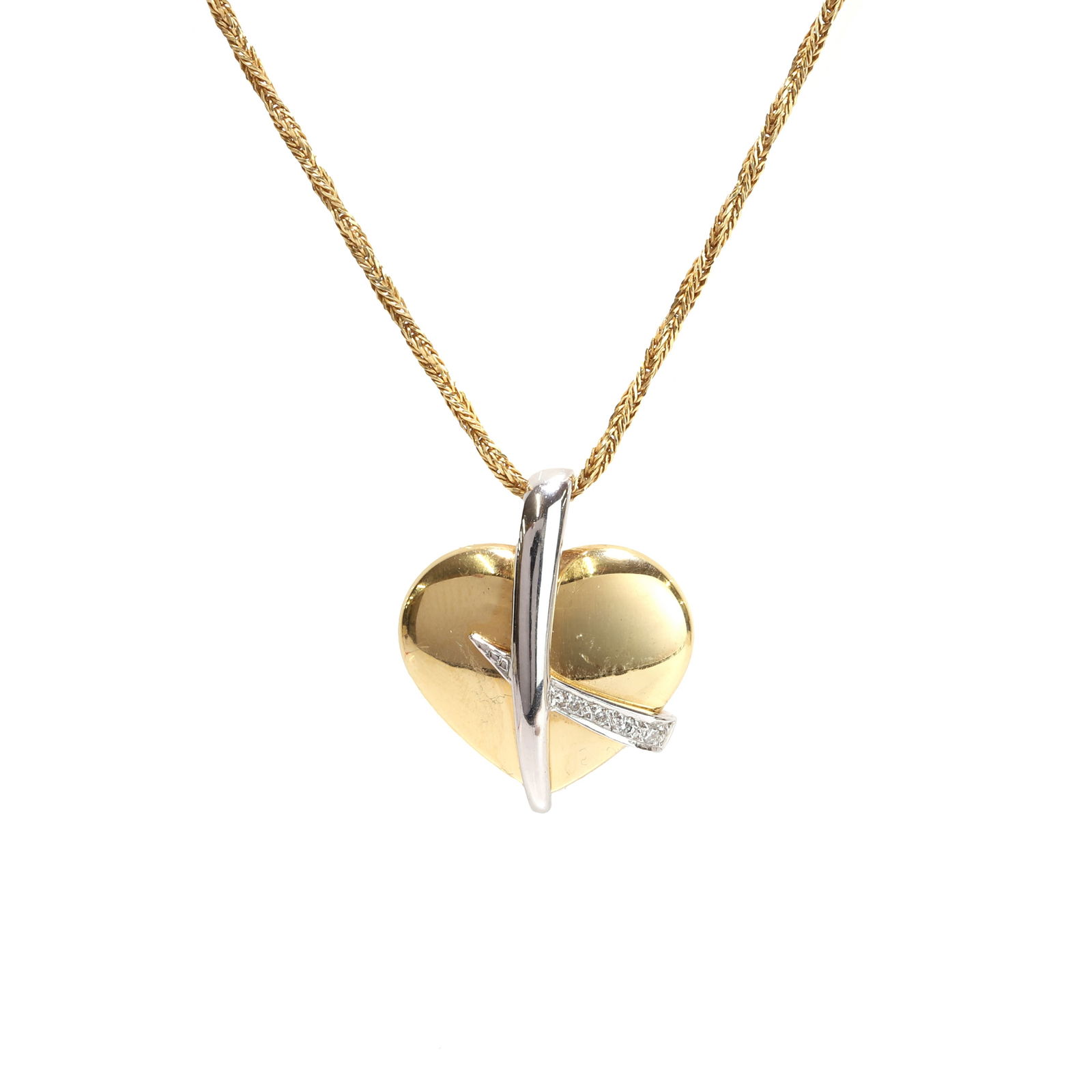 An 18ct gold two colour gold diamond set heart pendant, (1 of 2)