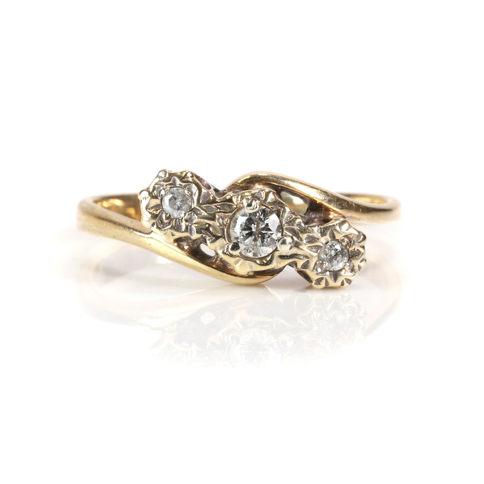 A 9ct gold diamond three stone crossover ring, (1 of 3)