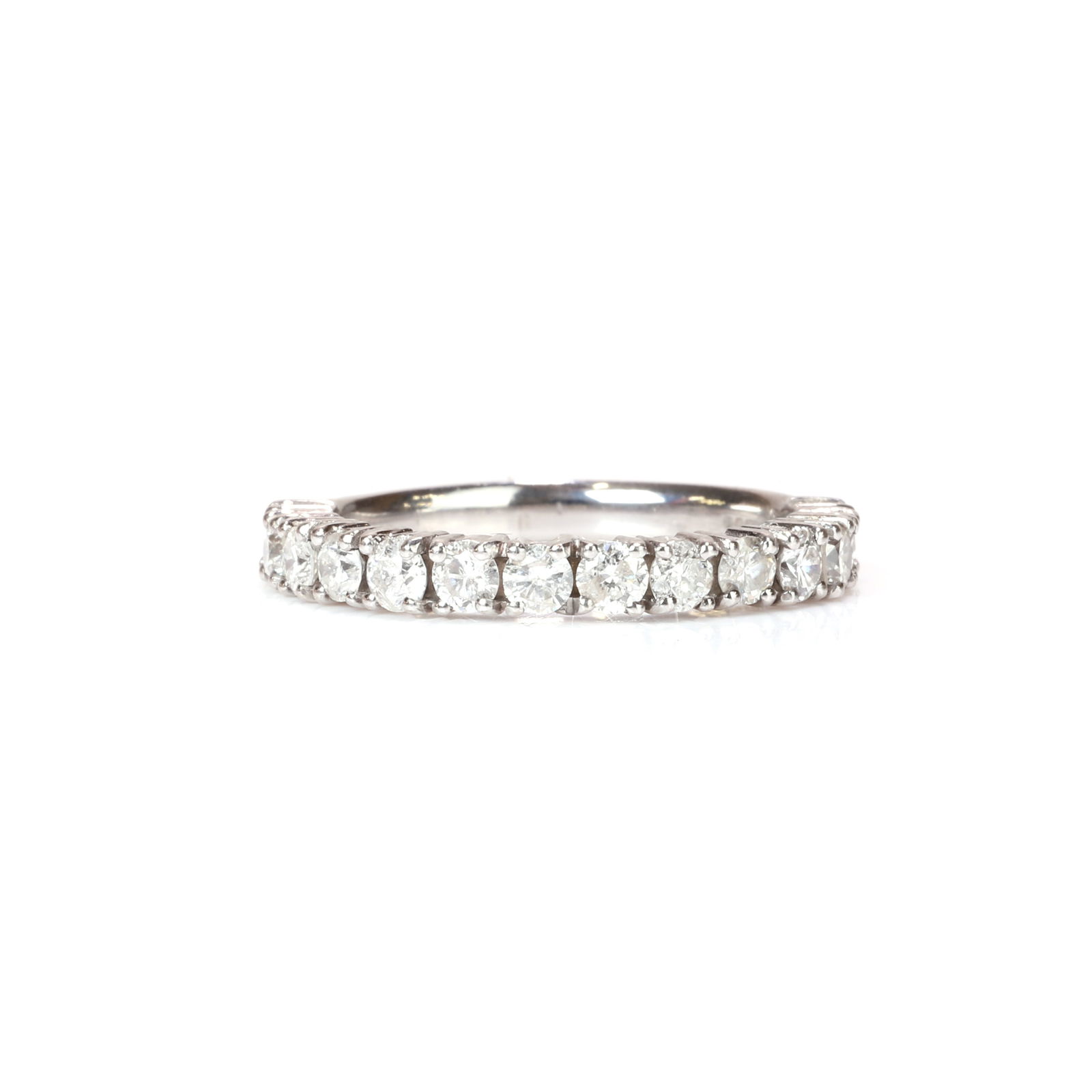 A platinum and diamond three quarter eternity ring, (1 of 3)