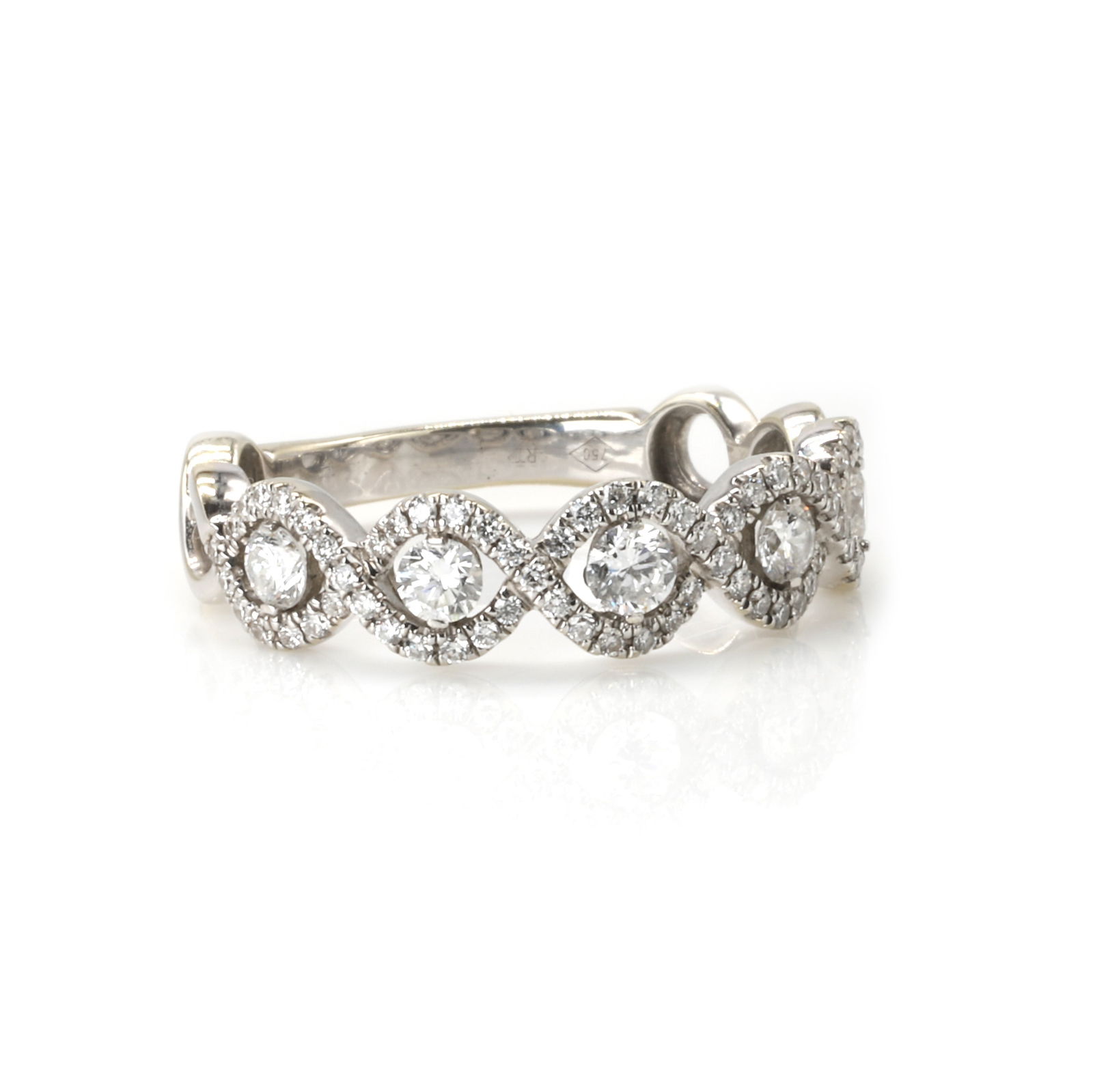 A diamond wave design half eternity ring, (1 of 3)