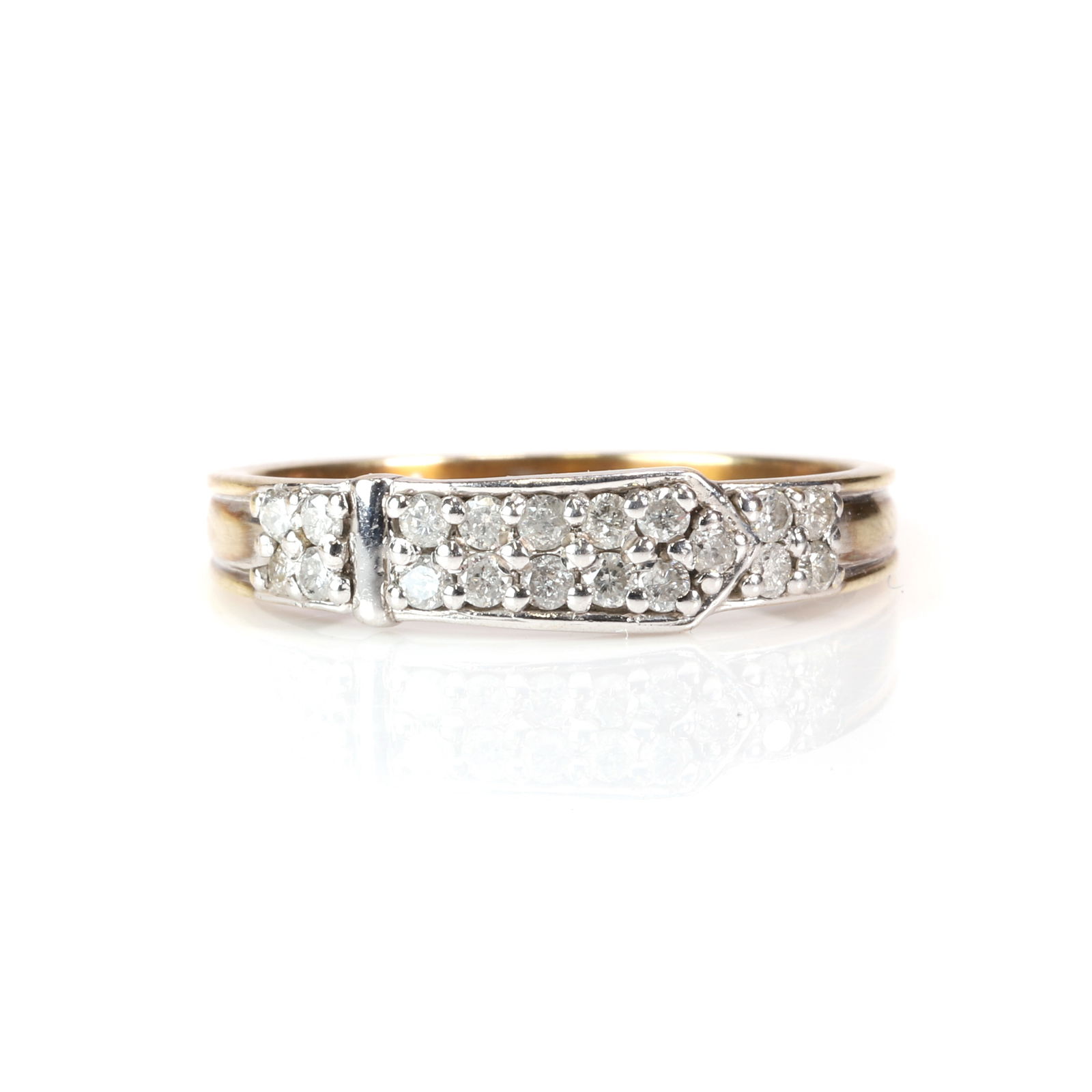 A diamond buckle ring,: A diamond buckle ring, the buckle mount grain set with round brilliant cut diamonds, into tapered shoulders and a flat section shank, tested as approximately 9ct gold (Ring size O½; 2.5g)