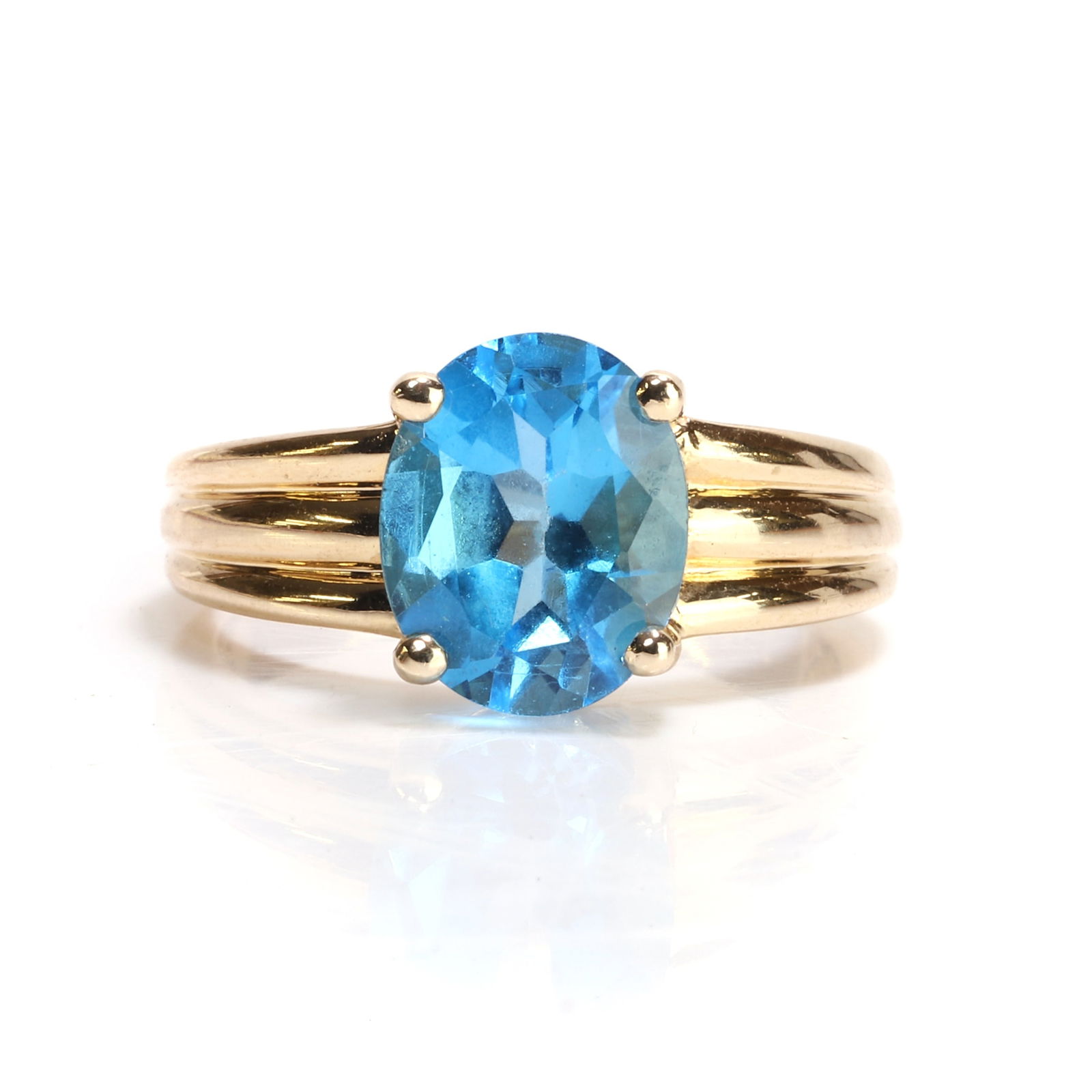 A topaz single stone ring, (1 of 3)