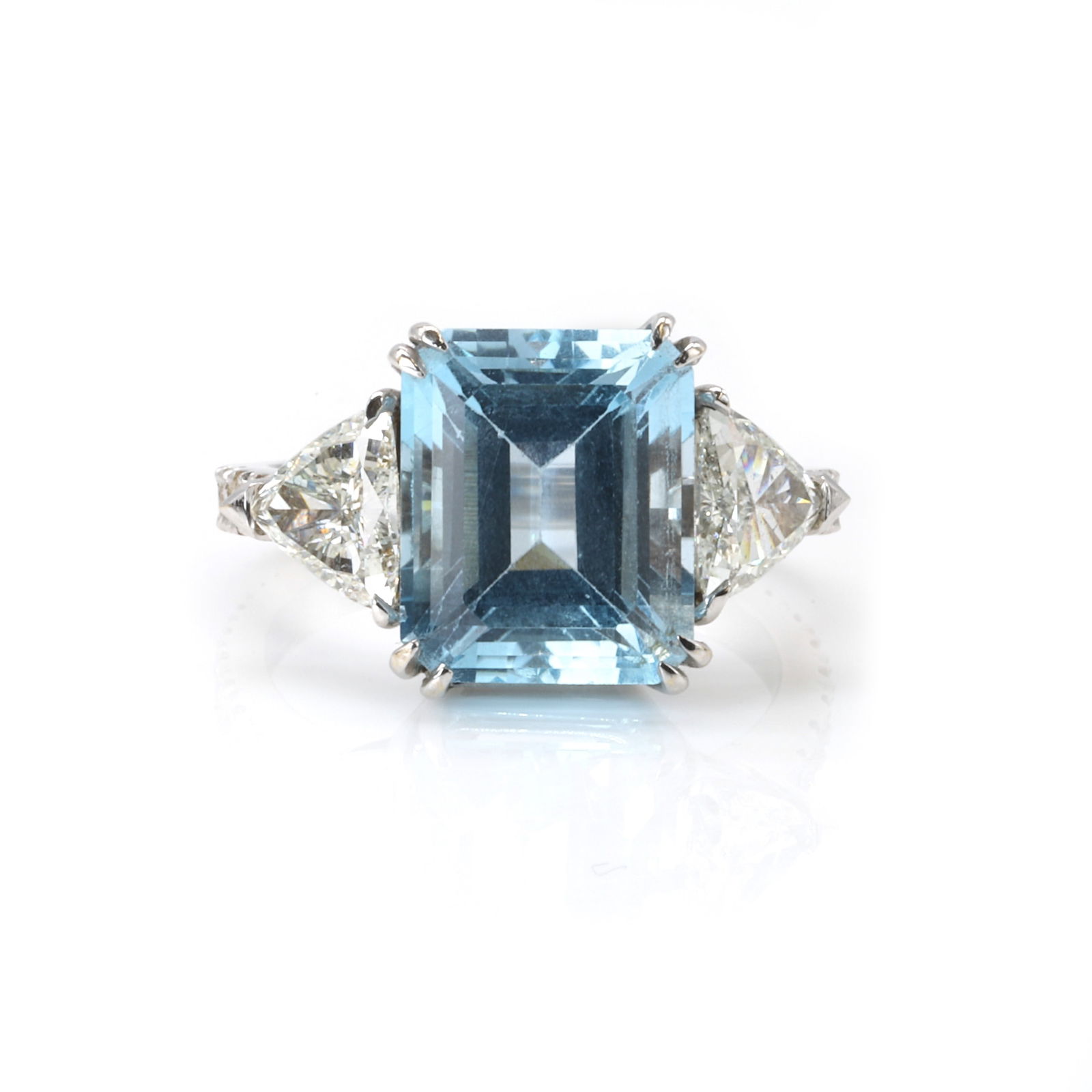 A blue topaz and diamond three stone ring, (1 of 3)