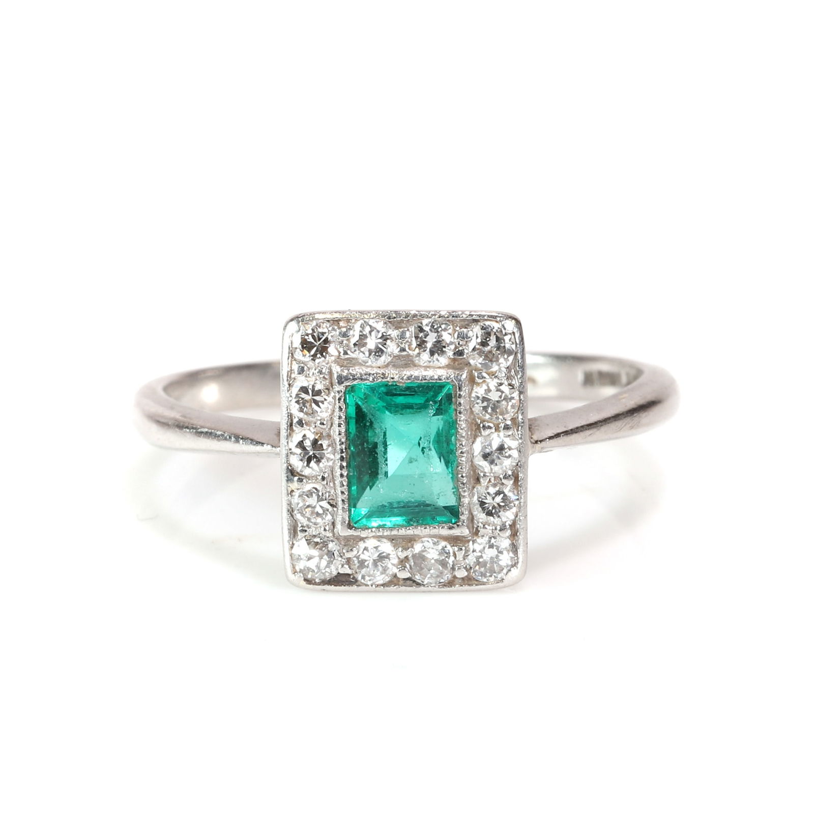 An emerald and diamond cluster ring, (1 of 3)