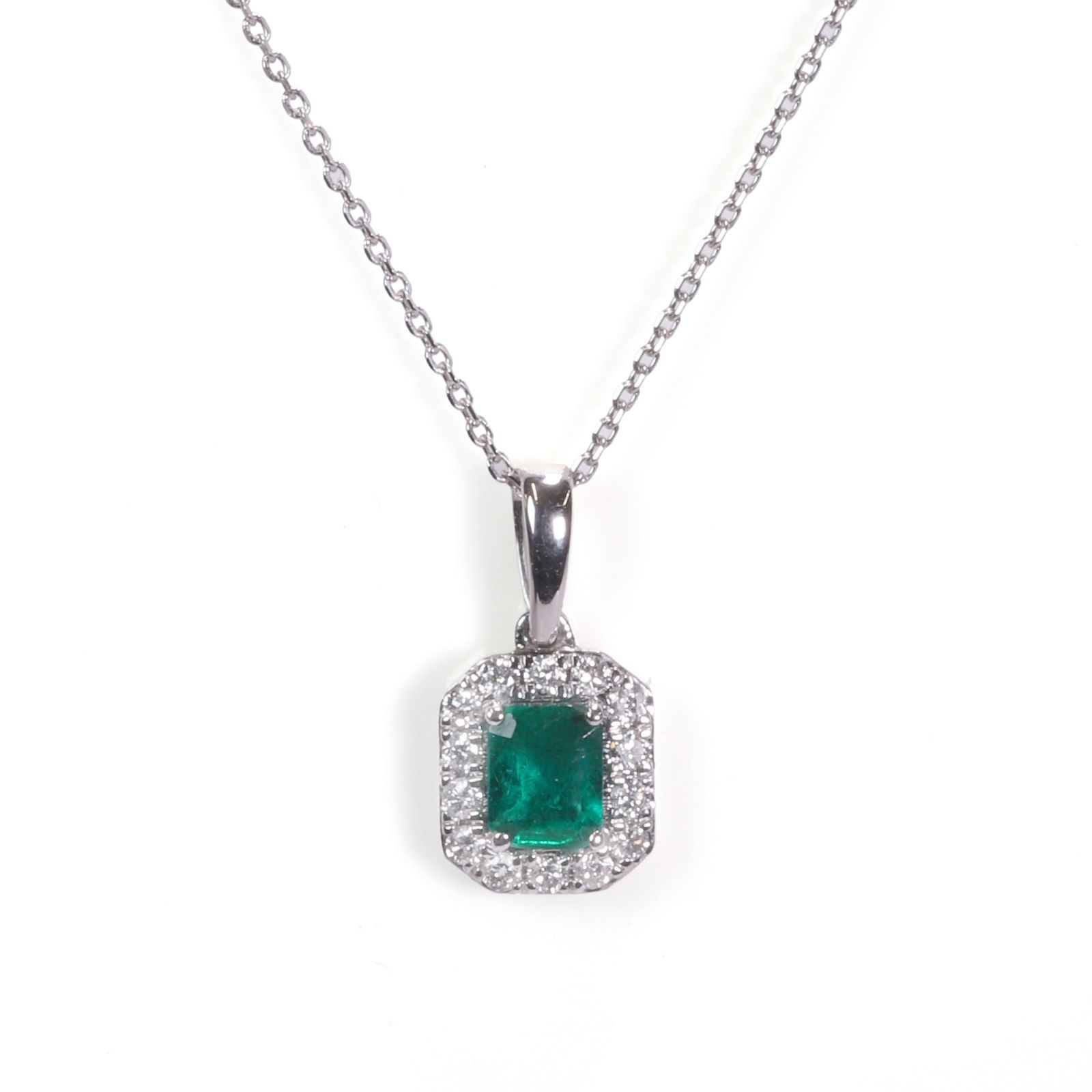 A 9ct white gold emerald and diamond pendant, (1 of 1)