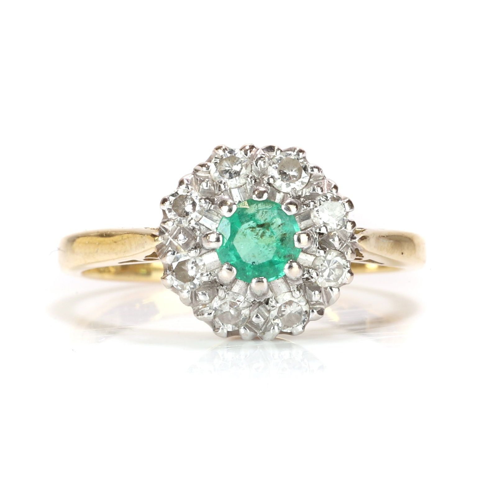 An 18ct gold emerald and diamond cluster ring, (1 of 3)