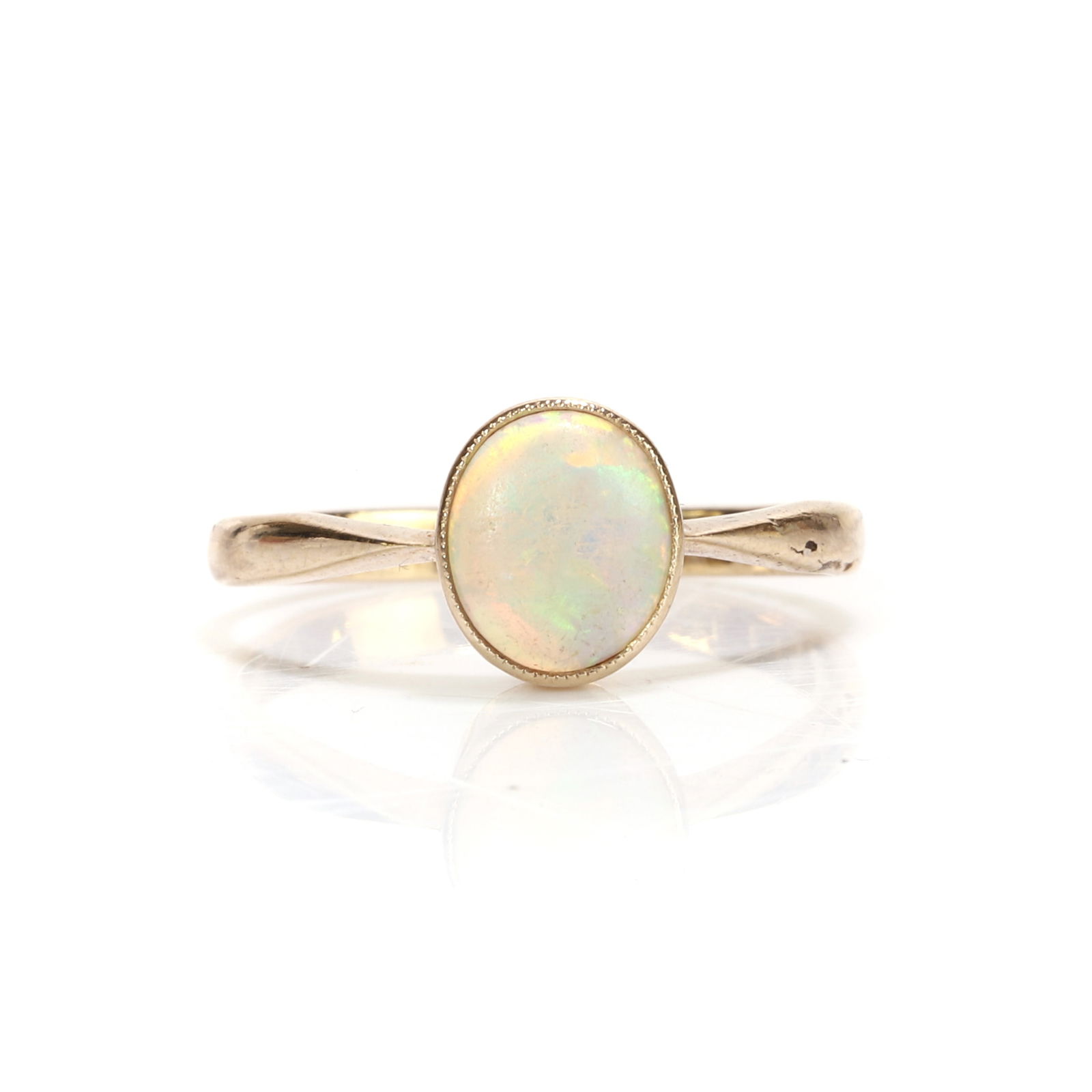 An opal single stone ring, (1 of 3)