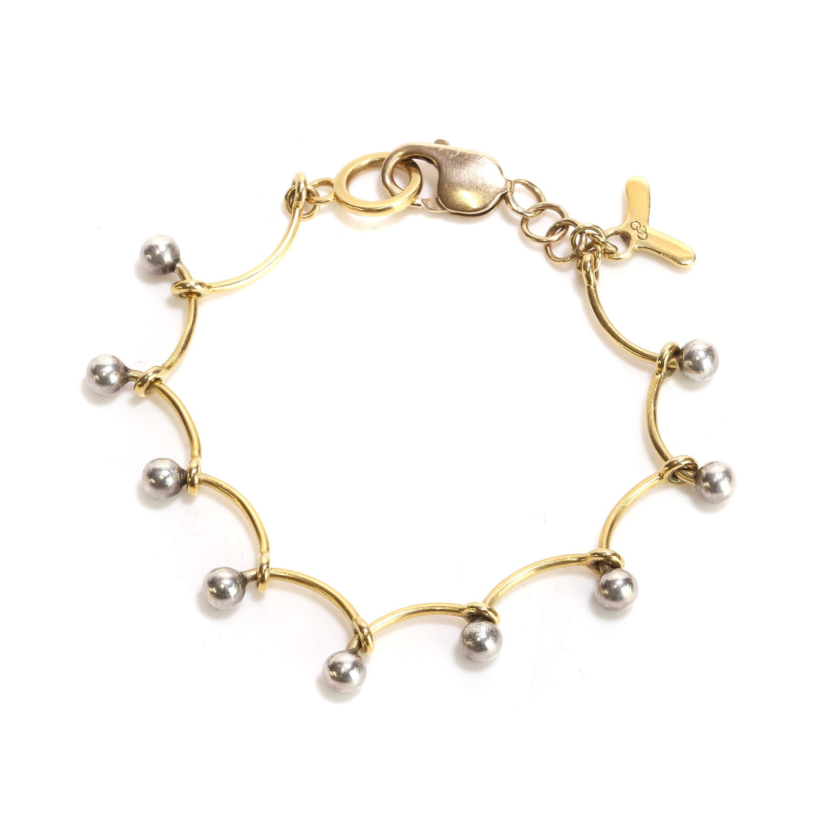 A gold and silver bead link bracelet: A gold and silver bead link bracelet with gold curved bar links with silver bead ends, to a chevron bar toggle clasp, tested as approximately 18ct gold and sterling silver, with a later side level cla