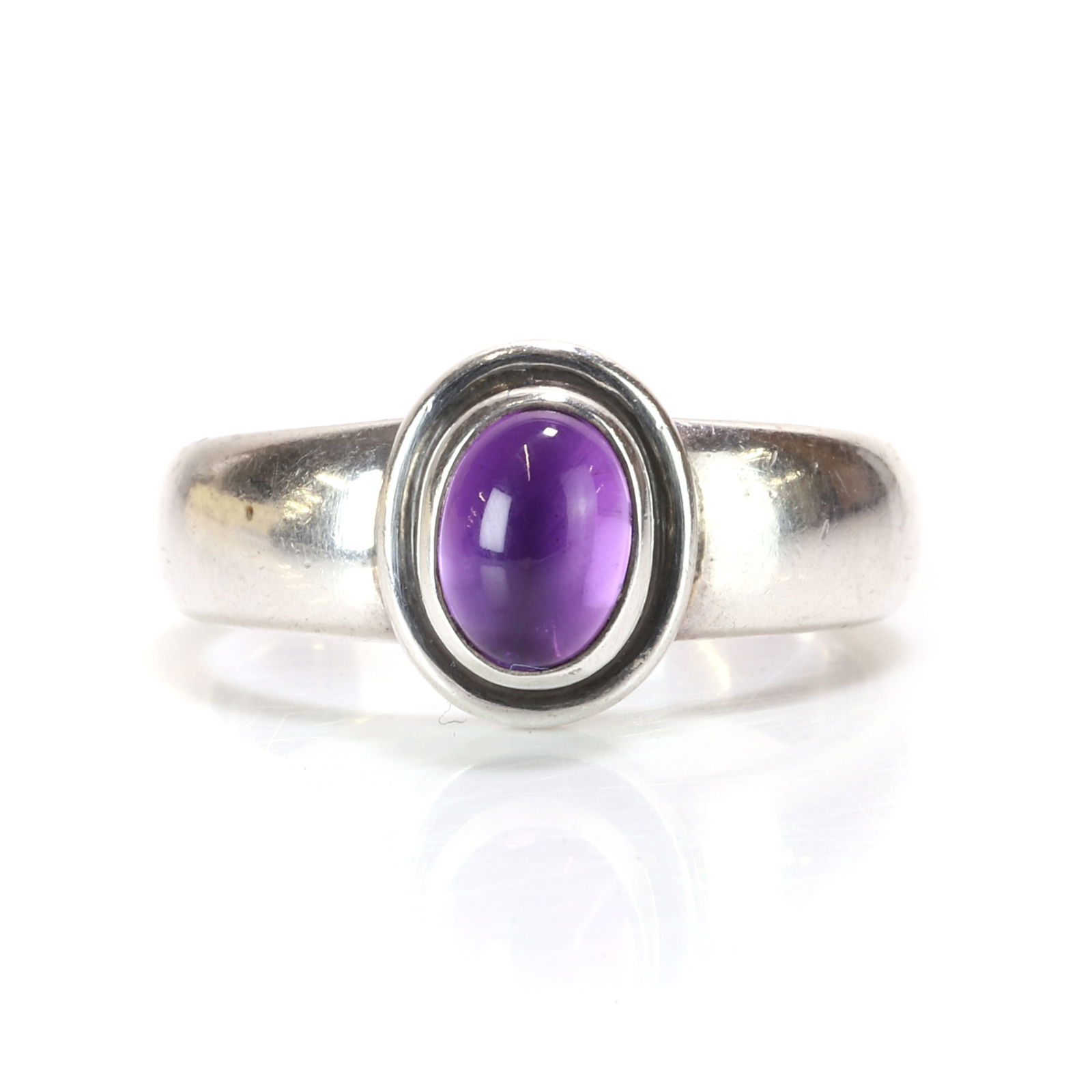 Georg Jensen, a silver amethyst single stone ring,: Georg Jensen, a silver amethyst single stone ring, no. 46C, with an oval cut amethyst, bezel set to an oval mount, upon a 'D' profile shank, maker's mark for Georg Jensen, marked 925S, London 2009 (Ri