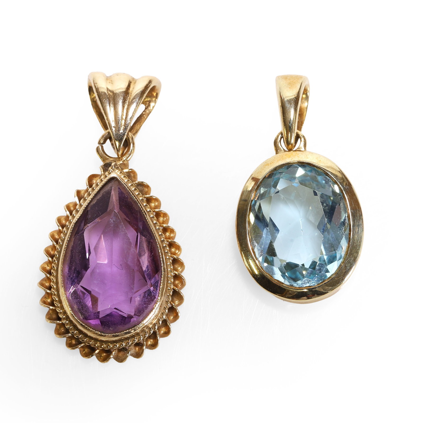 A 9ct gold blue topaz pendant and a 9ct gold amethyst pendant, (1 of 2)