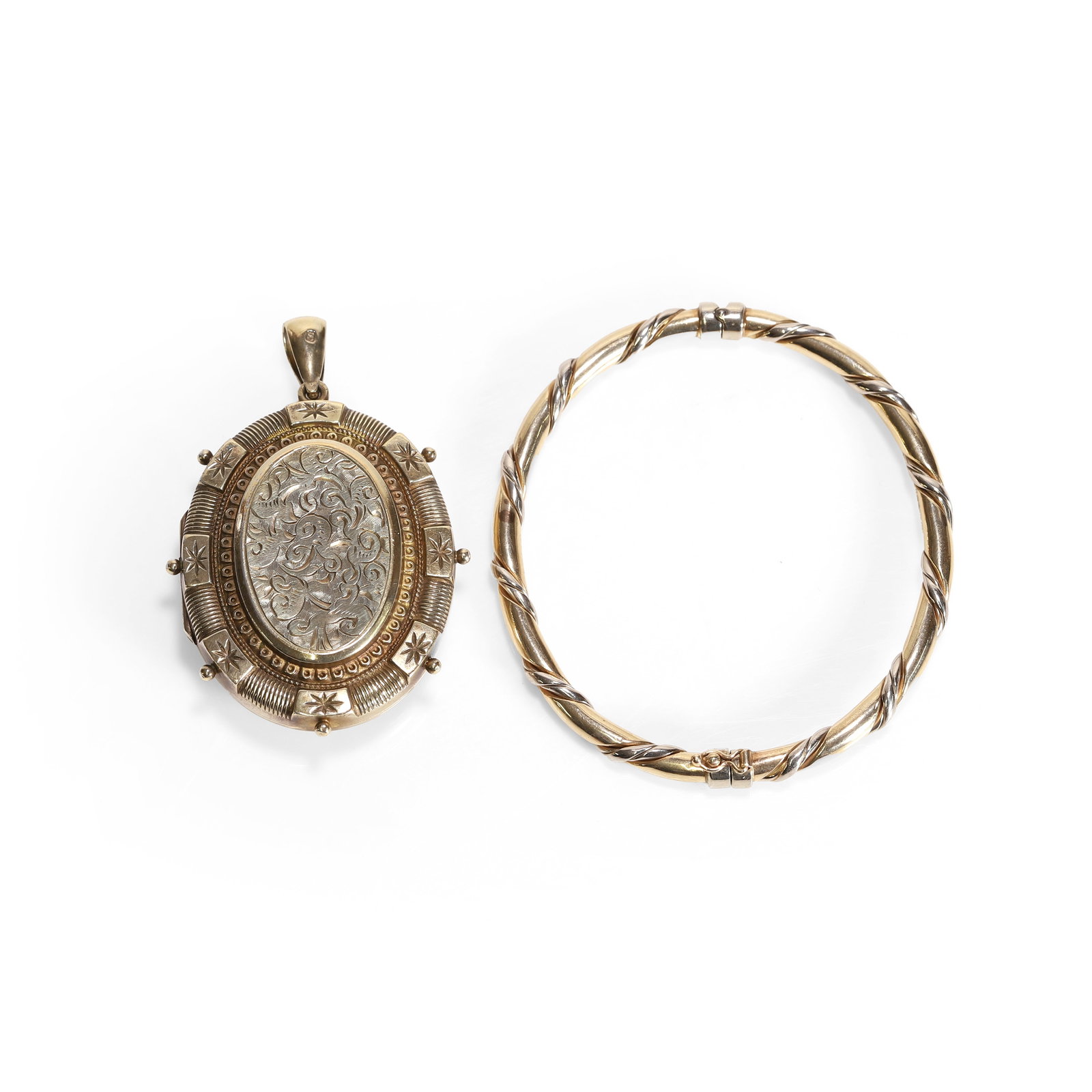 A two colour gold rope twist bangle and a Late Victorian silver gilt locket pendant, (1 of 3)