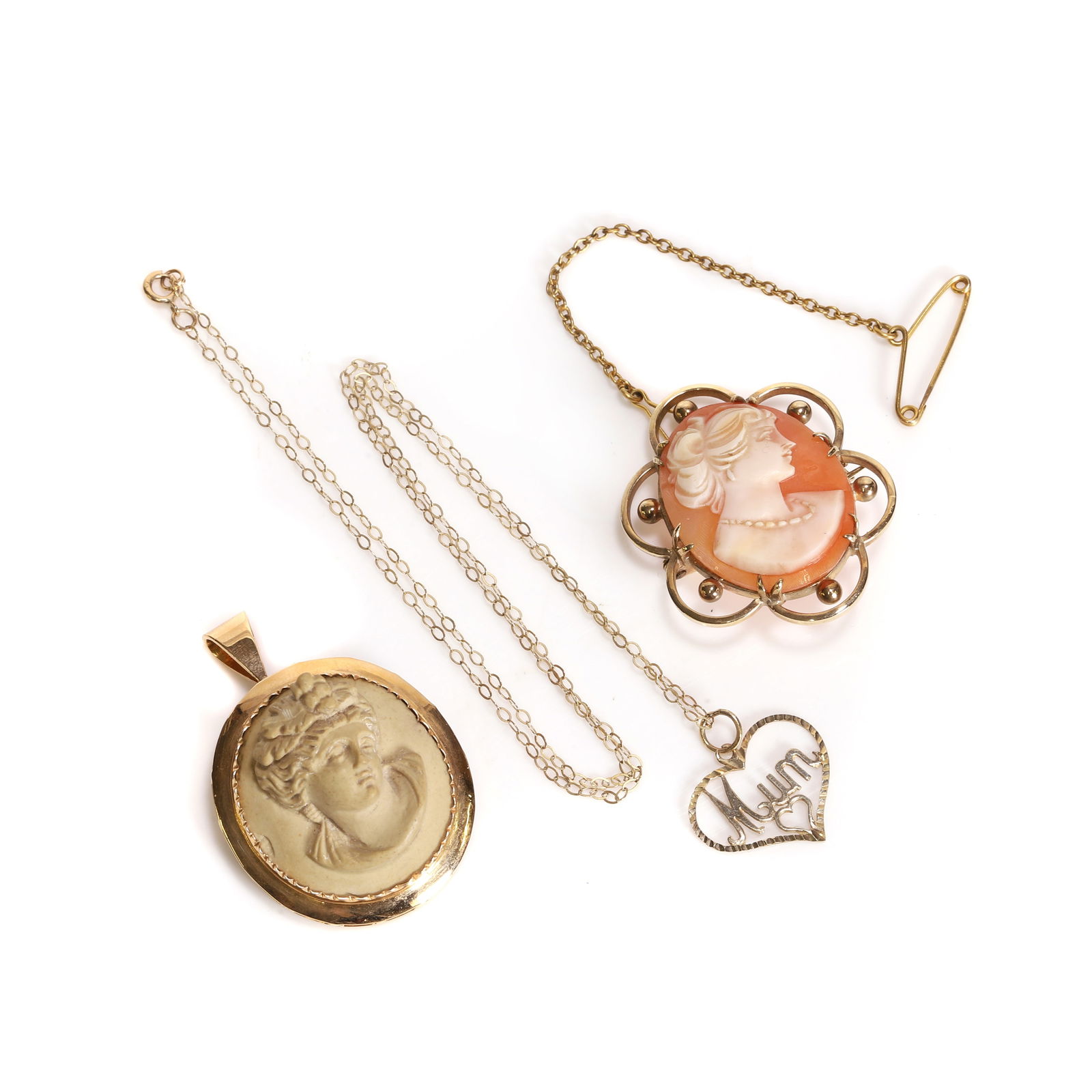 A small group of gold jewellery,: A small group of gold jewellery, comprising a gold mounted lava cameo brooch/pendant, tested as approximately 18ct gold, a 9ct gold shell cameo brooch, marked 9.375, and a heart-shaped 'Mum' pendant,