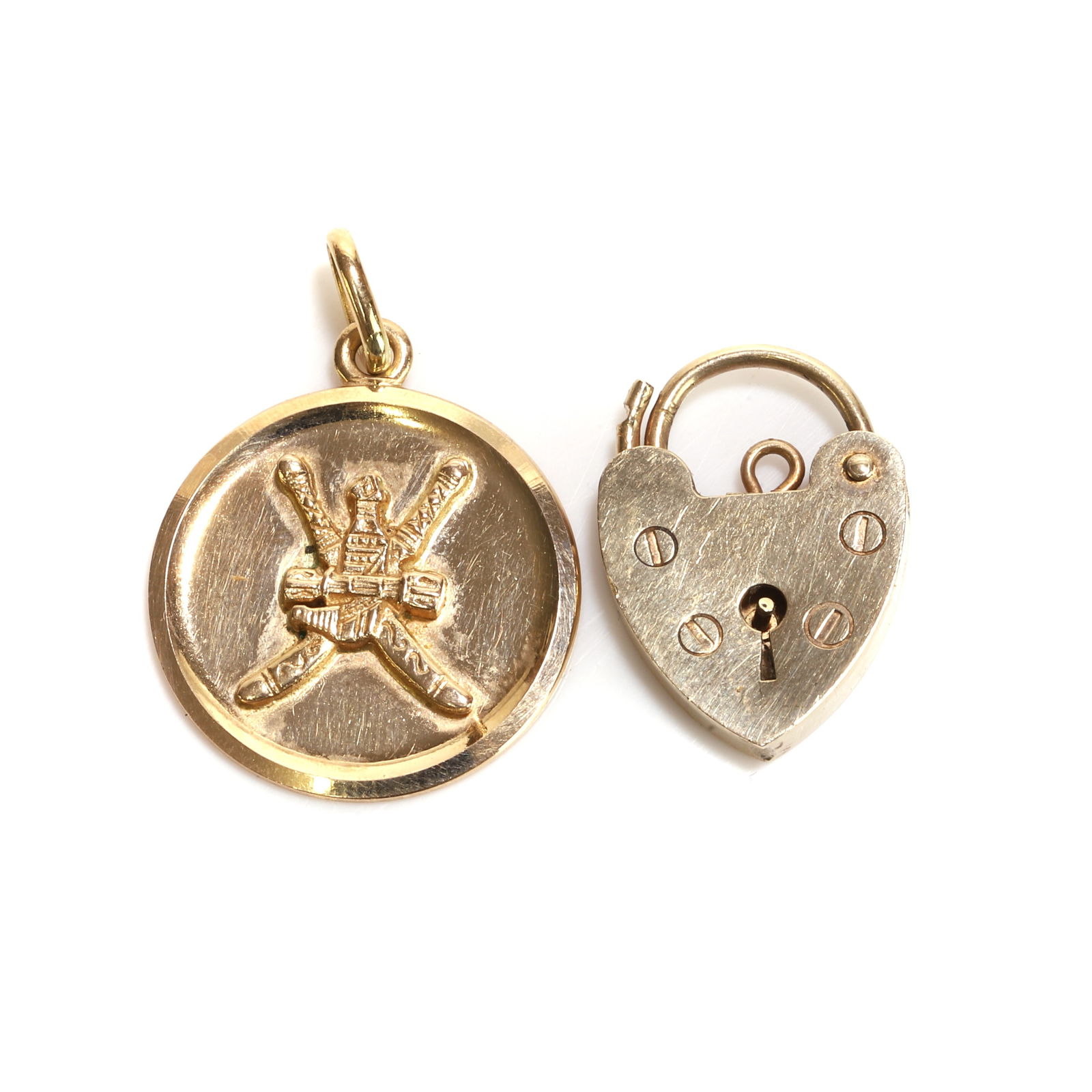 An 18ct gold medallion pendant and a 9ct gold heart locket, (1 of 2)