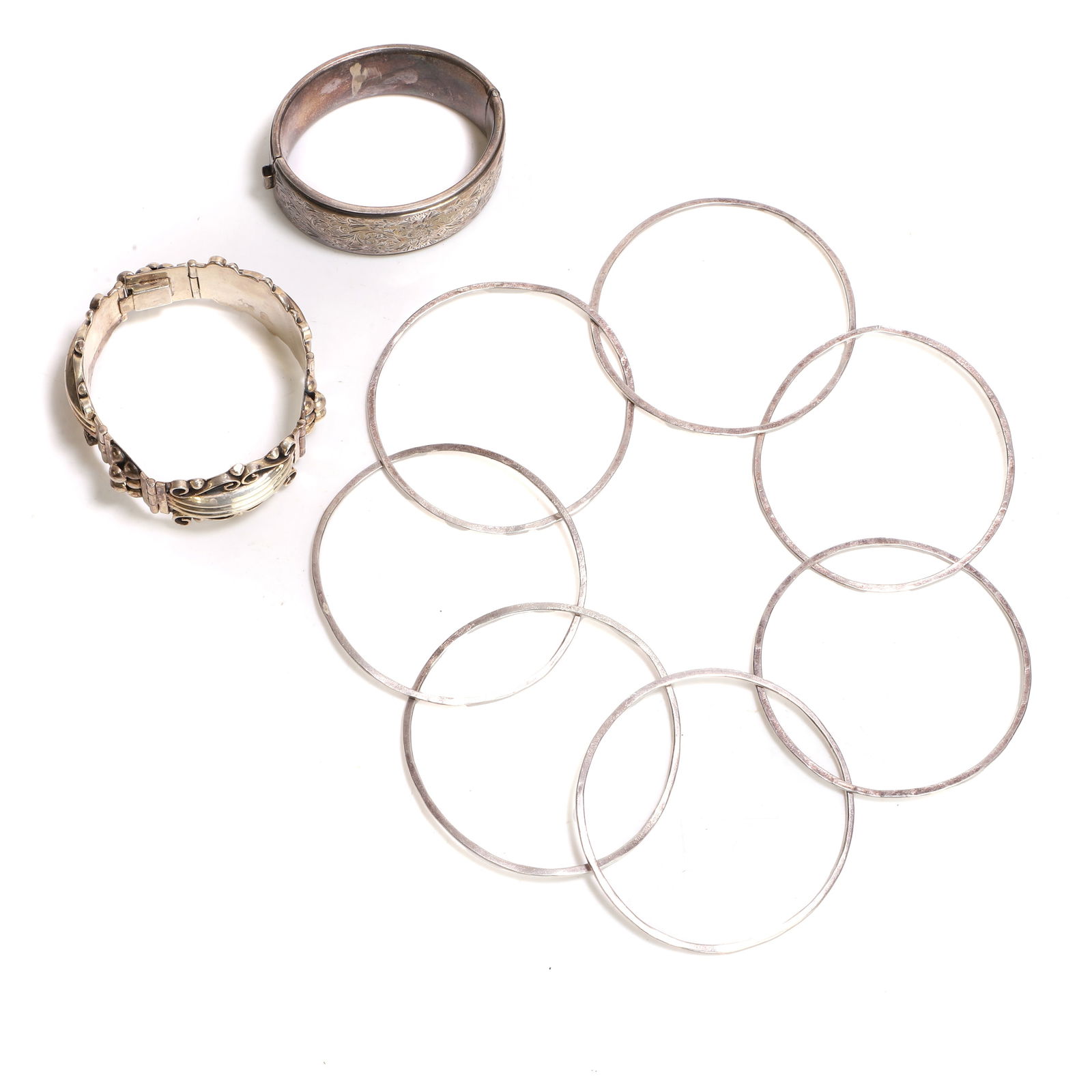 A group of silver bracelets, (1 of 3)