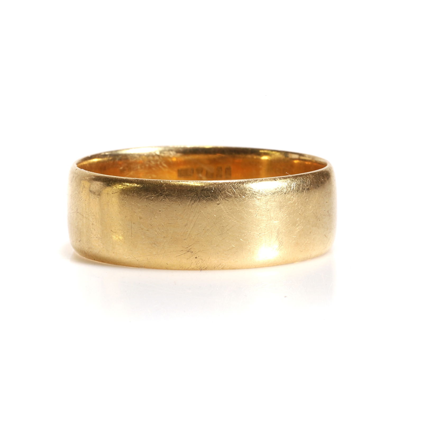 An 18ct gold wedding ring, (1 of 2)