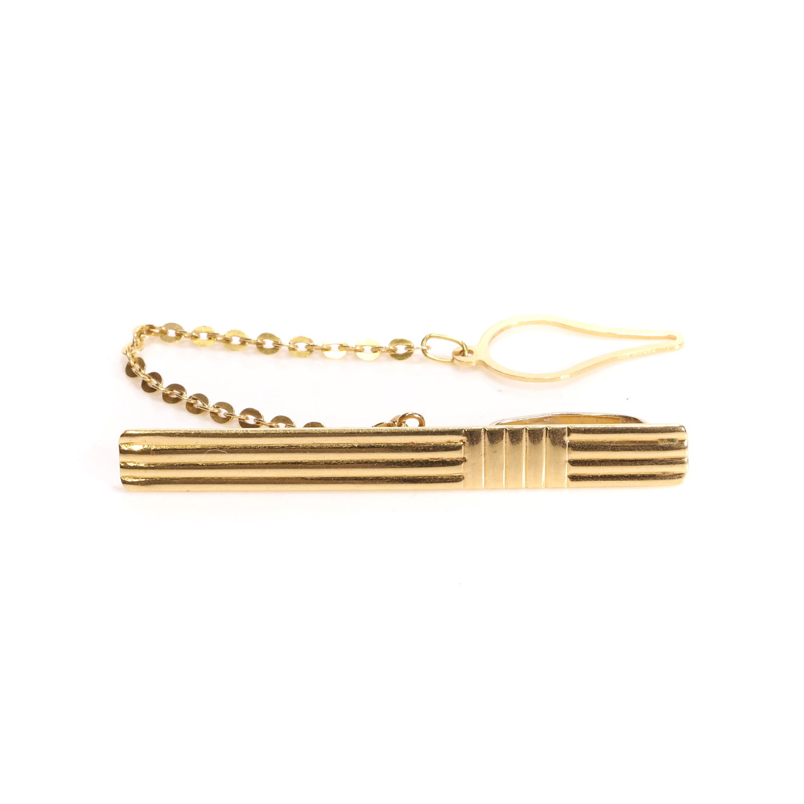 An Italian gold tie slide,: An Italian gold tie slide, with a rectangular reeded bar, to tie slide fittings and safety chain, Italian official national hallmark for 18ct gold standard, 1968 to present, for Arezzo (Length 5cm; wi