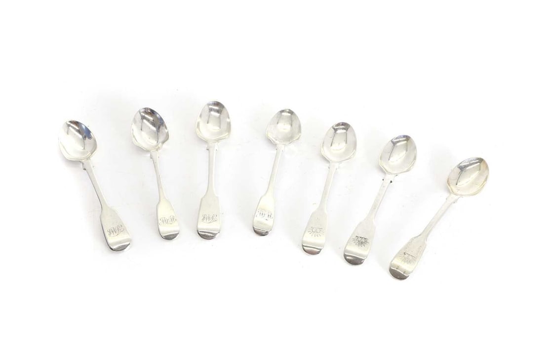 A set of three George III silver fiddle pattern teaspoons,: A set of three George III silver fiddle pattern teaspoons, marked 'WC', London 1826, each with sun crest to the handle, together with a set of four Victorian silver fiddle pattern teaspoons by