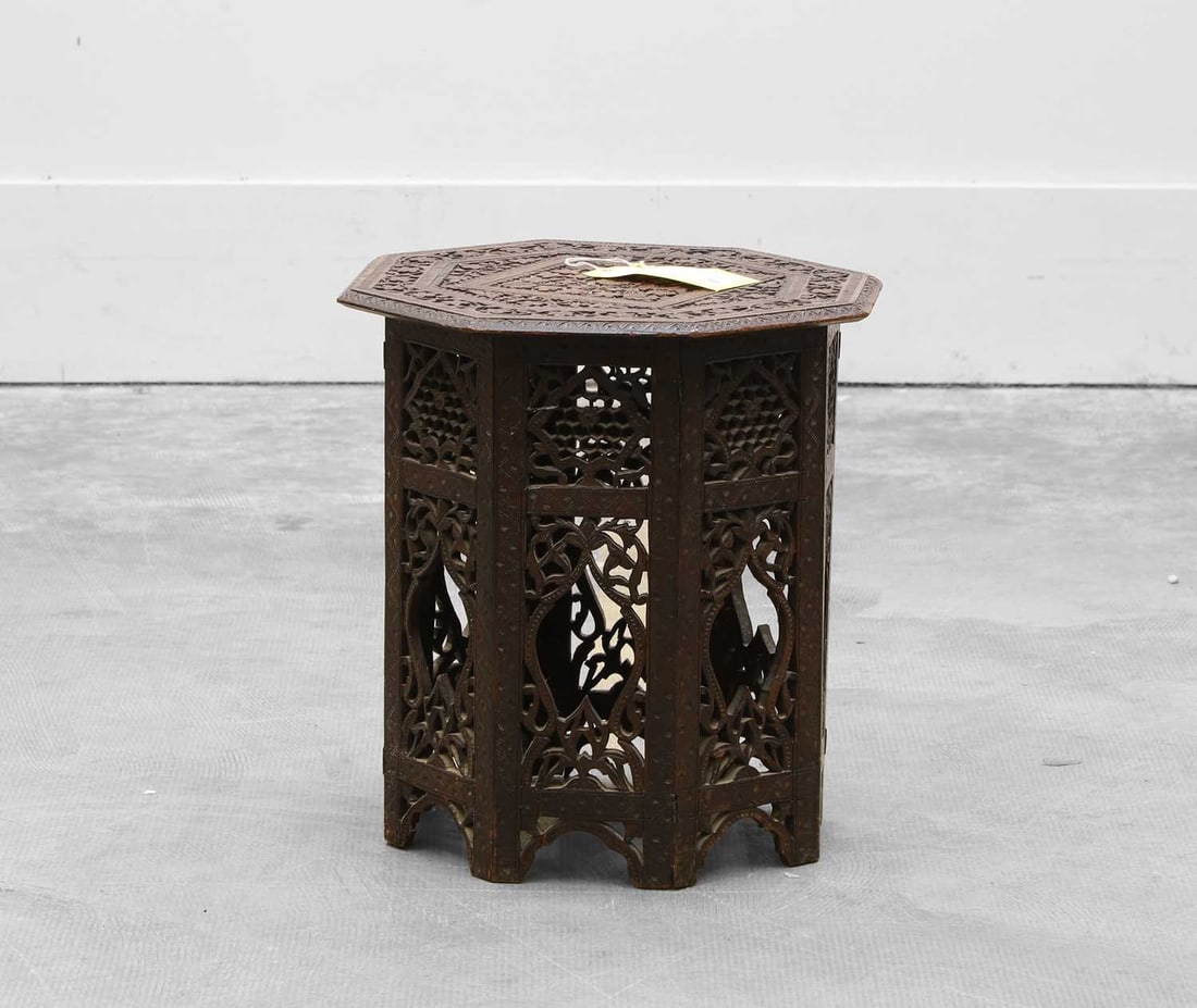 An Anglo-Indian carved hardwood octagonal top side table, Circa 1900,: An Anglo-Indian carved hardwood octagonal top side table, Circa 1900, with a matching profusely carved stand 38cm wide, 41cm wide
