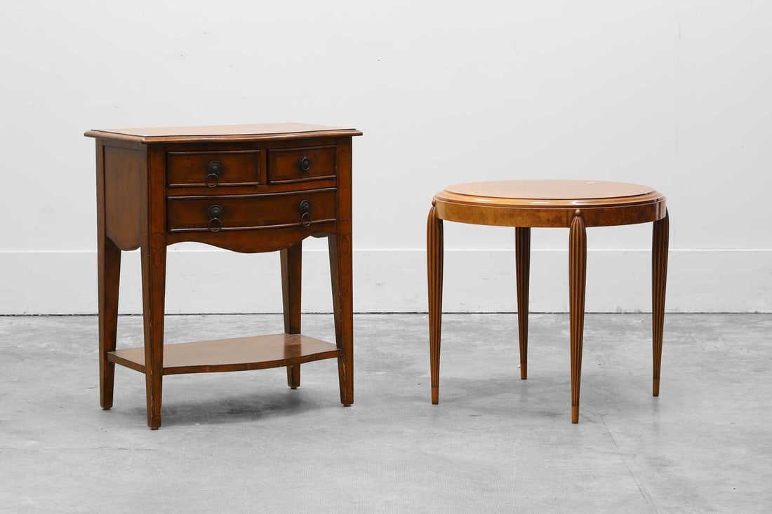 An Art Deco style burr walnut side table, Of modern manufacture,: An Art Deco style burr walnut side table, Of modern manufacture, the circular top with a moulded edge, raised on reeded supports, and a modern three-drawer side table table, 60.5cm diameter, 56cm