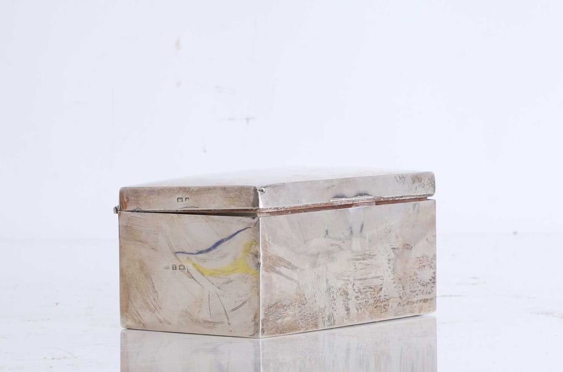 A silver cigarette box, Early 20th century,: A silver cigarette box, Early 20th century, marked 'ES', Birmingham 1905, of rectangular form, with a slightly hinged domed cover, the interior lined in wood 14.5cm wide, 9cm deep, 7cm high; total