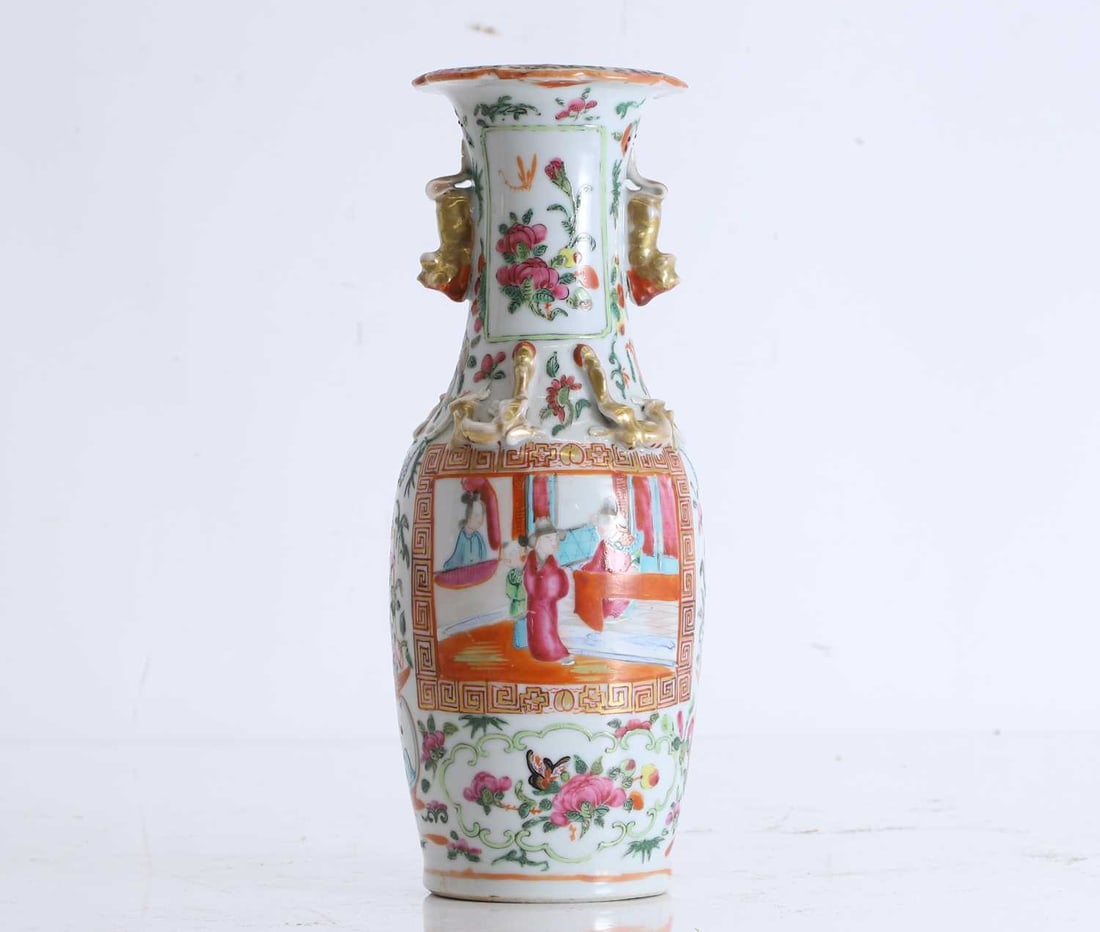 A Cantonese famille rose vase, 19th century, Chinese,: A Cantonese famille rose vase, 19th century, Chinese, painted with two panels depicting figures in an interior scene and birds amongst flowering and fruiting foliage, on a dense ground of figures,