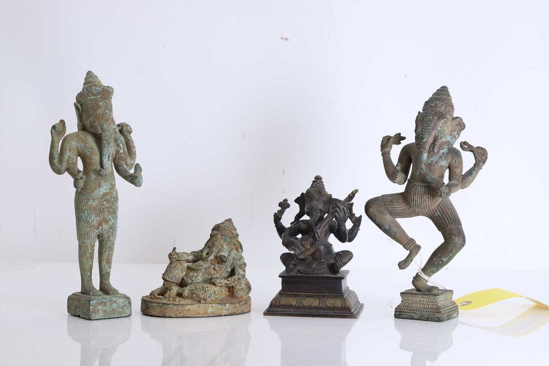 A collection of four bronze figures of Ganesh, 20th century, Indian,: A collection of four bronze figures of Ganesh, 20th century, Indian, two modelled in the Khmer style, holding various attributes, one example dancing, another also in the Khmer style modelled reclini