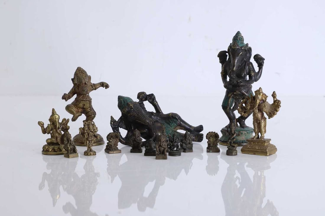 A collection of miniature brass figures of Ganesh, 20th century, Indian,: A collection of miniature brass figures of Ganesh, 20th century, Indian, two examples painted, modelled in various stances, The largest figure 5.5cm wide, 5cm deep, 13.5cm high 16