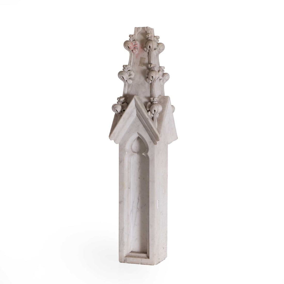 A Gothic revival style marble pinnacle 19th century: A Gothic revival style marble pinnacle 19th century in the form of a canopied tabernacle, the front with a shaped arch recess, surmounted by crocketed finials 15cm wide, 62.5cm high Condition