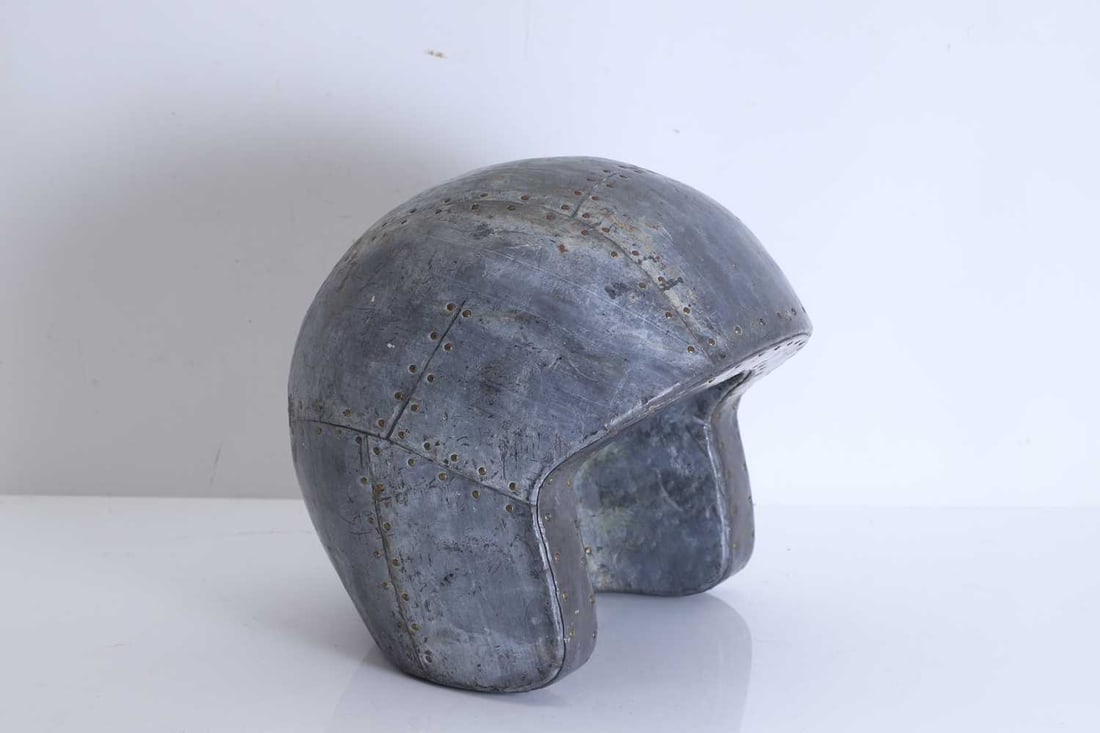 Martin Scorey (1961-2021) 'Helmet', contemporary,: Martin Scorey (1961-2021) 'Helmet', contemporary, 'Helmet', lead and wood, unsigned 25cm wide, 28cm deep, 25cm high Condition Report: With some scratches and wear.