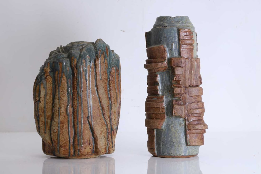 Two Bernard Rooke vases, Circa 1972,: Two Bernard Rooke vases, Circa 1972, The first with high relief geometric decoration and of cylindrical form, the second with blue drip effect to the glaze Taller vase, 31cm high; Shorter vase, 26.5c