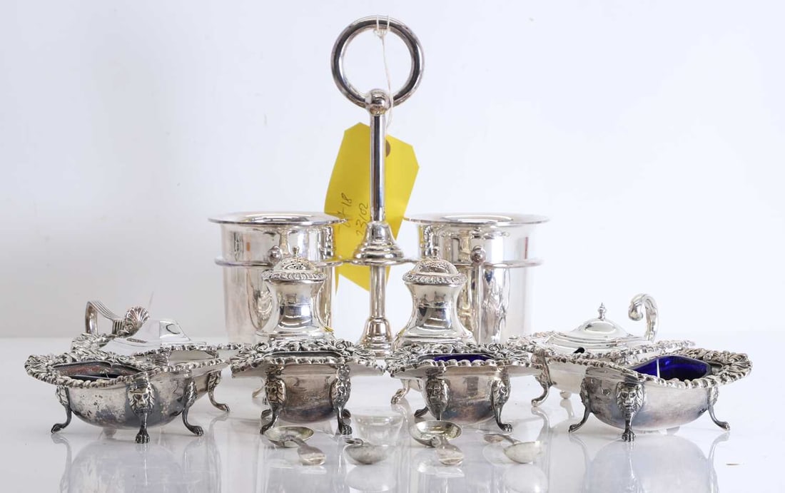 A collection of silver plated cruet items,: A collection of silver plated cruet items, all with decorative rims and with associated blue liners, together with four silver salt spoons, one by Mary Chawner, London, 1837, two by Henry Holland