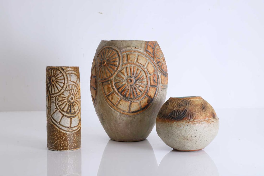 A collection of three Bernard Rooke ceramics,: A collection of three Bernard Rooke ceramics, a stoneware cylindrical vase, with wheel design to the exterior, circa 1967, stamped to the base, a stoneware squat vase, circa 1968, a stoneware