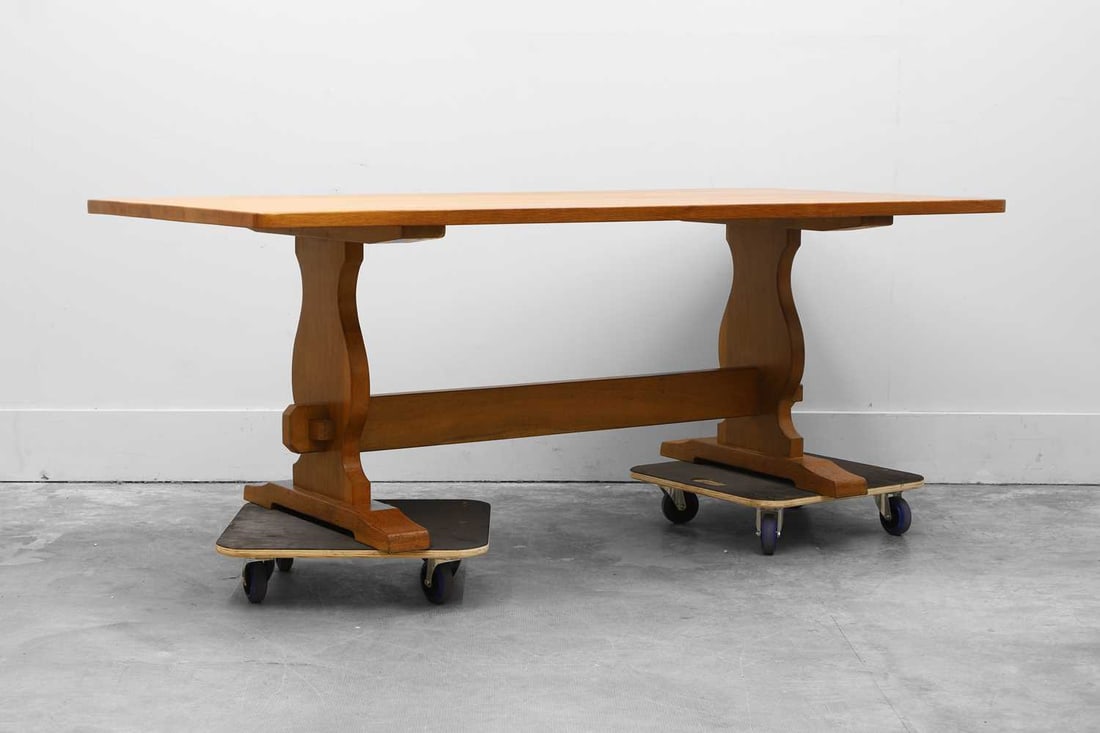 Derek 'Lizardman' Slater (b.1945) Late 20th century,: Derek 'Lizardman' Slater (b.1945) Late 20th century, an oak trestle dining table, with a plain top 202cm long 96.5cm wide 74cm high