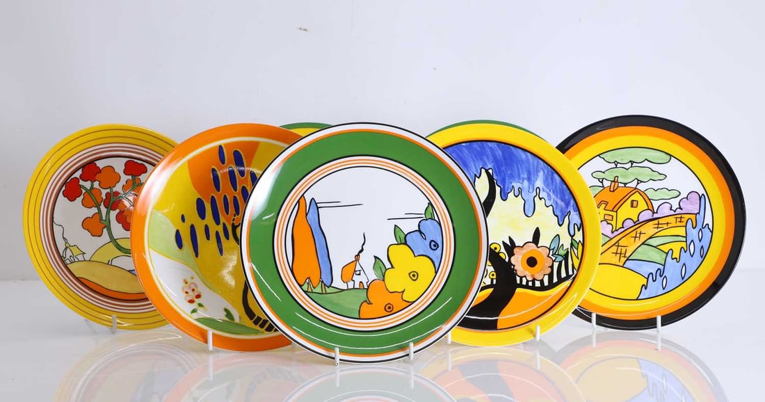 A collection of Clarice Cliff cabinet plates, Of modern manufacture,: A collection of Clarice Cliff cabinet plates, Of modern manufacture, from the Big Anne collection to include patterns, Honolulu, Tulip, Bridgewater, Orange Roof Cottage, Garden Blue, Windbells, Red